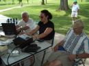 Teresa, NS9C, pounds out some CW QSOs at the GOTA station under the patient elmering of Don, ND0M and Greg, KC0RET.
