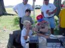 Bill Henderson, K0VBU helps a scout with "mic. fright"