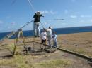 Bob - KH7FX deals with the Yagi on the ladder while the rest of the members lend support.