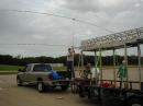 Johnny Robinson KJ5LB the "Tower of Power" man (C), centering our Hygain tribander on his mobile tower unit.
