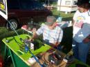 Tom W0UY picks up the bonus points for QRP contacts with hiw Elecraft K2 while Emergency Management Director Bill Guy KC0VBF looks on.