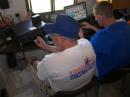 RCKARA President Tim, KA4CKR works the main field day station while Jon, AJ0NR logs the contacts. The rig, computer and even the trailer belong to Reno County Emergency Management.