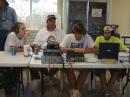 Jim Kernan (KC0WHI) watches GOTA members:  Ivy Lovendahl, Brent Nispel, Logan Nispel (KC0VUH), and Matt Rasico (KC0VUG).  The GOTA station was NEVER without an operator and logger for 24 hours!