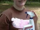 To help ward off antenna problems, Katie Brooks, KI4FNT, brought along a full bottle of &lt;b&gt;Formula 599 - Anti SWR Aerial Cleaner,&lt;/b&gt; promising that it "Powers thru QRM." Katie, a budding graphic artist, created new ham radio-related labels for the cleaning product. 