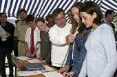 Students aboard Russian sailing vessel speaking into microphone.