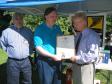 Danbury Mayor Mark Boughton presents CARA with a Proclamation.  Harlan observes while Frank accepts the plaque.