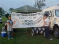 Julie Harris -KG4SCU and Stephen Stoles hang the club banner first thing Saturday morning.