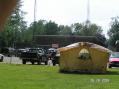 The North Tonawanda Fire Headquarters and Emergency Management Building in the background, with the Jim N2UHJ "Outdoor Experience" tent in the foreground. Thumb of the lovely Pris KC2PSF special feature. - Credit Pris KC2PSF