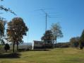 Newly cleared area around the antennas and shack. The vertical to the left is for 160, although it was pressed into 80M service during SS. 80M dipole supported on the AB-621 and a 40M Delta loop barely visible to the right of the shack.