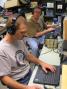 <b>AF8A</b> and <b>W8RZ</b> trade bands to snag every QSO possible at the W8EDU multi-op.  <i>W8WTS photo</i>