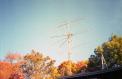 Dual-polarization 4-yagi array at K1JT, with beautiful fall colors in the background. Single yagis for 50, 222, and 432 MHz are atop the EME array.