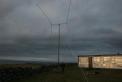 Shack and quad and Galway Bay at the edge of the Burren.