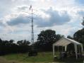 Daytime picture of the N3SH mobile tower trailer (designed and built by Randy George N3ZK) next to the N3SH SSB operating tent.  Photo courtesy of Ron Telek W3LE &amp; used with his permission