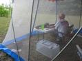 The operating position with solar panel behind the tent.