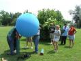 FD chairman Tom, W8FIB, fills our balloon with helium for a 100 foot vertical!