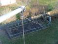 At the Apex of the inverted L looking down to the SE corner of my lot to the 10' support pole. Wire then makes a sharp turn left to the north to a Maple tree