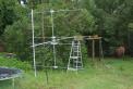 The newly constructed 2x4 tiltover tower with the mast and antennas mounted, ready to rotate up...
