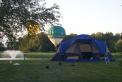 Hot air balloons float by during setup Friday evening