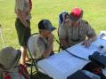 Mr. Van Horne, KA6U, assists a Troop 500 scout in making a contact during JOTA.