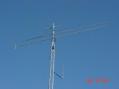 Top to bottom: 3 elt 6m, 10 elt 222, M2 432-13WL, Cushcraft 4218XL. 2m J-Pole at lower right is my APRS IGATE station.