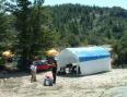 The shelter is up and the beam building crew is busy.
