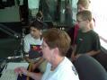 Mary, K1MMH, at the mike, while Dan KA1IIP, Alan and Cortney get ready to take their turn.