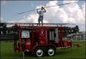 Kevin Thomas prepares to set up a 100-foot antenna for communication reception