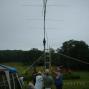 With rain apporaching quicky, members of the 10-70 Repeater Association complete the antenna set-up for the VHF/UHF station.