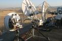 Three stations at CM97kh: Left to right: WA6CGR's rig used by KH6WZ, N6CA's offset-fed 30-inch dish, and AD6FP's 6-foot offset-fed dish. Signals from that 6-footer must have blown away everyone's receivers! 