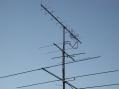 Note the 23cM coax dipole mounted to the mast between the 70cM and 2M yagi'. 
<p>
Used 30' of RG-58 and made contacts 30 miles away with S9 signal report.</p>