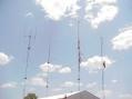 Bunkhouse, Towers, and Antennas on a Sunny Day. L to R, 2m tower, 6 meter tower, UHF tower, Internet and Telephone tower
<p></p>