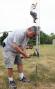 Rick Hannan, N9XGM, hammers in a stake as he and  Jordan Carter, K9NZF, work to secure a temporary tower as the emergency communications group EmComm ECI sets up the W9YFD Field Day site in Muncie, IN on Saturday, June 23, 2007.