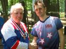 Dick Arnett, WB4SUV, of Kentucky (left), receives his medal for first place finish in the M60 category at the 2009 USA Championships near Boston. Dick is a co-chair of the organizing committee for the upcoming 2010 USA championships. Presenting the medal is Vadim Afonkin, KB1RLI, who organized the 2009 events. [Joe Moell, K0OV, Photo]