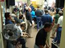 A briefing at Hawaii State Civil Defense EOC prior to the arrival of the anticipated tsunami. The display panels are on the wall on the left. [Ron Hashiro, AH6RH, Photo]