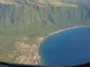 Most of the village of Kalaupapa as seen from an airplane. This photo also includes a section of the sea cliffs that form a natural barrier between the Kalaupapa peninsula and "Topside" Molokai. [Photo and description courtesy of Ruslan Vladimirovich Albitsky, via Wikipedia Commons]