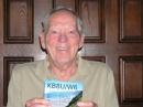 Pat Rose, W5OZI, holds up the last-needed QSL card to receive the Fred Fish Memorial Award #2.