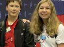 Audrey McElroy, KM4BUN (right) will be awarded 2022 Young Ham of the Year at the Huntsville Hamfest. She's seen here with her brother, Jack McElroy, KM4ZIA, at convention in August 2021. [Bob Inderbitzen, NQ1R, photo]