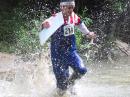 ARDF competitors must run through a marked corridor to the finish line. For the 80 meter event, the corridor went through Harker’s Run, a creek swollen by recent rains. George Neal, KF6YKN, who won a medal at the last World Championships, ran through the creek at top speed with his antenna/receiver set and map board. [Joe Moell, K0OV, photo]