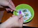 Figure 5 — Soaking the stamps in warm water to separate them from their envelopes.
