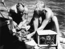 Knut Haugland and Torstein Raaby working the radios on board the <em>Kon-Tiki</em>.