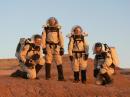 Four team members from Georgia Tech's MDRS Crew 69 are all suited up and ready to explore Mars at sunrise one morning. LeftRight: Dan Crowley, KJ4CQI; Tulika Raj, KJ4CKX; Andrea Hartlage, KG4IUM, and Sean Blackman, KJ4CRD. [Elisha Sanders, KJ4CQM, Photo]