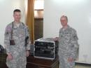Army Major Scott Hedberg, AD7MI (left), of Leavenworth, Kansas, hands over the BARS station duties to Army Captain Jeffrey Hammer, N9NIC, of Speedway, Indiana, in April 2008. [Photo courtesy of Army MARS]