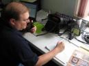 With the Red River expected to crest to more than 43 feet, an Amateur Radio operator with the Red River Radio Amateurs Club (RRRA) in North Dakota provides communications support at an EOC in Fargo. [Photo courtesy of Mark Johnson, KC0SHM]