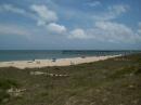 A look down the beach at the Avon Fishing pier.