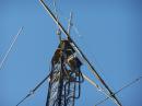 Here is a view of the tower top box with a homebrew switching system for three yagis. I used 20 amp 12 volt power relays in a PVC box. The main feedline is 1 5/8" heliax and the individual phase matched feeders for each yagi are 7/8" size. The VSWR is pretty good for each combination.
