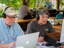 Ed Kelley (K1NUH, left) logs for Dino Papas (KL0S, right) during the Sunday morning operations of the K4RC Field Day. Photo by Dan Ewart, WG4F.