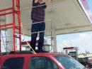 How tall is it?  12 ft 3".  Less high than a semi trailer truck.  On purpose.  I don't want to be a curb feeler for a low bridge!  :)  Also, any higher and I wouldn't be able to make corrections occasionally.  I'm getting too old to climb on top of the car. 