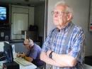 Ernie, W1DO, chats while Cal, W1CRK, operates the VHF station