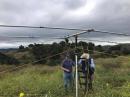 N1BKB and K6NA making final preparations to hoist our Hy-Gain TH-2, used primarily for 15 and 10 meters.