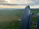 A great start to the day in FN02. The 5GHz dish in the foreground as the sun takes care of the morning haze in the background.. 